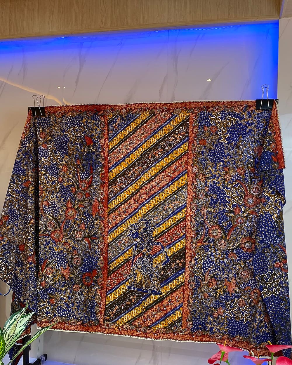 Sarung batik tulis Lasem tiga negeri with red, blue and brown grounds
