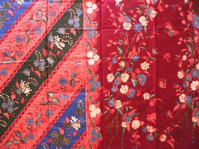 Lasem hand-drawn batik cloth in deep red